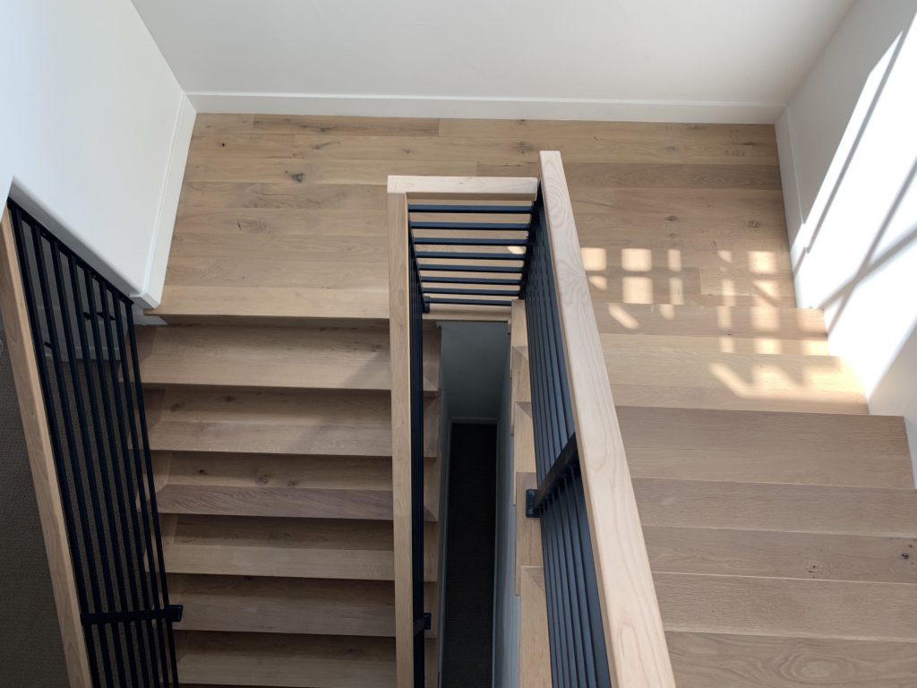 Staircase and railing woodwork hardwood flooring